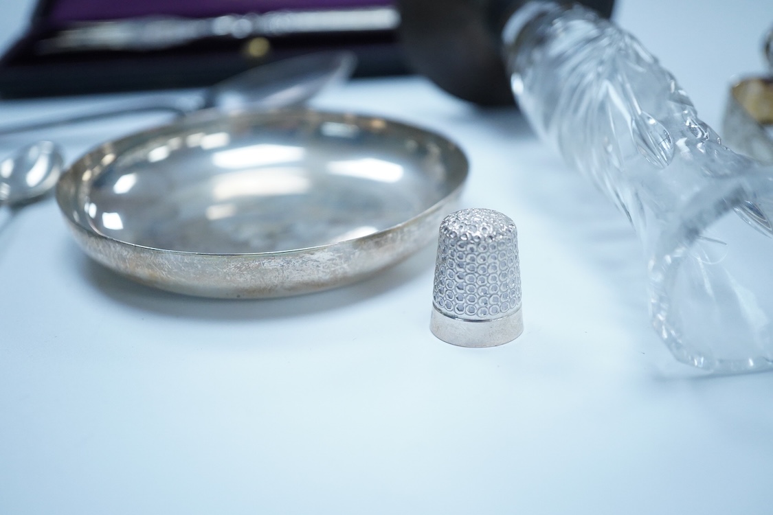 A collection of small silver to include a George V engraved concave card case, I. S. Greenberg & Co, Birmingham, 1912, 80mm, a cased late Victorian small bread fork, a modern mounted glass posy vase, an Irish nut dish, a